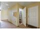 Hallway with a storage area and apartment entrance at 6395 Banyan Blvd # 204, New Port Richey, FL 34652