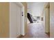 Bright condo hallway with an elevator, stairs, and access to the outside at 6395 Banyan Blvd # 204, New Port Richey, FL 34652