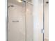 Shower with glass doors, tile surround and a seat at 8726 Latham Drive, Hudson, FL 34667