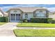 One-story house with a two-car garage and neatly landscaped yard at 4750 Carrington Ct, New Port Richey, FL 34655