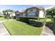 Well-maintained exterior with neat landscaping and walkway at 4750 Carrington Ct, New Port Richey, FL 34655