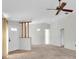 Spacious living room with wall-to-wall carpet and ceiling fan at 4750 Carrington Ct, New Port Richey, FL 34655