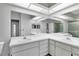 Bathroom with double vanity, large mirror, and separate shower at 4750 Carrington Ct, New Port Richey, FL 34655