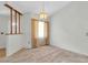 Bright dining room with a chandelier and built-in shelving at 4750 Carrington Ct, New Port Richey, FL 34655