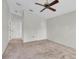 Spacious Primary bedroom with ceiling fan and ample closet space at 4750 Carrington Ct, New Port Richey, FL 34655