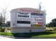 Trinity Oaks shopping center sign, featuring various stores and services at 4750 Carrington Ct, New Port Richey, FL 34655