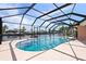 Enclosed kidney-shaped pool with canal view at 2044 Montana Ne Ave, St Petersburg, FL 33703