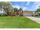 Single-Gathering home with a large lawn and attached garage at 2044 Montana Ne Ave, St Petersburg, FL 33703
