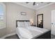 Cozy bedroom with queen bed, nightstand, and large window with plantation shutters at 3448 Triggerfish Dr, Hernando Beach, FL 34607