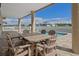 Covered patio with table and chairs overlooking the pool at 3448 Triggerfish Dr, Hernando Beach, FL 34607