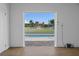 View of pool and backyard oasis from the garage at 3448 Triggerfish Dr, Hernando Beach, FL 34607