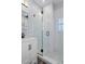 Clean bathroom with white vanity, frameless shower, and marble countertop at 3448 Triggerfish Dr, Hernando Beach, FL 34607