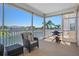 Enjoy this screened porch with water views and grill at 3448 Triggerfish Dr, Hernando Beach, FL 34607