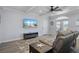Living room with a large TV and access to a balcony at 3448 Triggerfish Dr, Hernando Beach, FL 34607