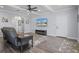 Relaxing living room with grey walls, a large TV, and wood-look floors at 3448 Triggerfish Dr, Hernando Beach, FL 34607