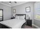 Bright bedroom with queen bed, nightstands, and large window at 3448 Triggerfish Dr, Hernando Beach, FL 34607