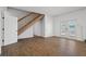 Large basement with hardwood floors, staircase, and French doors at 3448 Triggerfish Dr, Hernando Beach, FL 34607