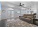 Spacious living room with comfortable seating and access to a back patio at 3448 Triggerfish Dr, Hernando Beach, FL 34607