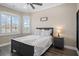 Cozy bedroom with queen bed, nightstand, and large window with plantation shutters at 3448 Triggerfish Dr, Hernando Beach, FL 34607
