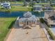 Two story waterfront home with attached two car garage, paver driveway, and canal view at 3448 Triggerfish Dr, Hernando Beach, FL 34607