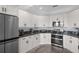 Modern kitchen with white shaker cabinets and stainless steel appliances at 3448 Triggerfish Dr, Hernando Beach, FL 34607