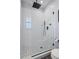 Spa-like bathroom with walk-in shower, rainfall shower head, and marble countertop at 3448 Triggerfish Dr, Hernando Beach, FL 34607