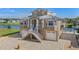 Two story waterfront home with attached two car garage and paver driveway at 3448 Triggerfish Dr, Hernando Beach, FL 34607