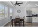 Bright dining area with dark wood table and white cabinets at 3448 Triggerfish Dr, Hernando Beach, FL 34607