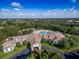 Community pool and clubhouse with surrounding landscape at 1183 Mystic Ct, Spring Hill, FL 34609