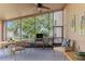 Cozy screened porch with outdoor furniture and view of the backyard at 1183 Mystic Ct, Spring Hill, FL 34609