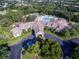 Community pool and clubhouse with surrounding landscape at 1183 Mystic Ct, Spring Hill, FL 34609