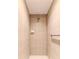Clean shower with beige tile and grab bar at 1183 Mystic Ct, Spring Hill, FL 34609