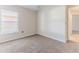 Spacious bedroom with neutral walls, carpet flooring, and a window with blinds at 1183 Mystic Ct, Spring Hill, FL 34609