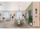 Elegant dining room with staged furniture and large windows at 1183 Mystic Ct, Spring Hill, FL 34609