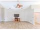 Large living room with ceiling fan and built-in entertainment center at 1183 Mystic Ct, Spring Hill, FL 34609