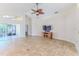 Bright living room with tile floors and sliding glass doors at 1183 Mystic Ct, Spring Hill, FL 34609