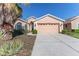 Two-car garage and manicured lawn at 1183 Mystic Ct, Spring Hill, FL 34609