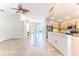 Open concept kitchen with breakfast bar, tile flooring, and views into living area at 1183 Mystic Ct, Spring Hill, FL 34609