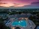 Aerial view of community pool and clubhouse at sunset at 1183 Mystic Ct, Spring Hill, FL 34609