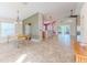 Bright dining room features a light bamboo table and neutral tile floors at 1183 Mystic Ct, Spring Hill, FL 34609