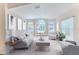 Living room featuring contemporary furniture and ample natural light at 1183 Mystic Ct, Spring Hill, FL 34609