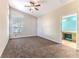 Spacious bedroom with carpeted floor, ceiling fan, and ensuite bathroom access at 1183 Mystic Ct, Spring Hill, FL 34609