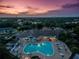 Aerial view of community pool and clubhouse at sunset at 1183 Mystic Ct, Spring Hill, FL 34609
