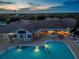 Aerial view of community pool and clubhouse at sunset at 1183 Mystic Ct, Spring Hill, FL 34609