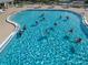 Community pool with people participating in water aerobics at 1183 Mystic Ct, Spring Hill, FL 34609