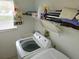 Laundry room with washer, dryer, and storage space at 4201 Avanti Cir, New Port Richey, FL 34655