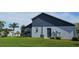 Exterior view of the house with gray and white siding at 4201 Avanti Cir, New Port Richey, FL 34655