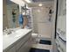 Clean bathroom with walk-in shower and updated vanity at 4201 Avanti Cir, New Port Richey, FL 34655