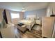 Bright bedroom featuring a king-size bed and plenty of storage at 4201 Avanti Cir, New Port Richey, FL 34655