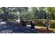Relaxing bench overlooking a tranquil pond, nestled within a lush, tree-lined park at 4201 Avanti Cir, New Port Richey, FL 34655